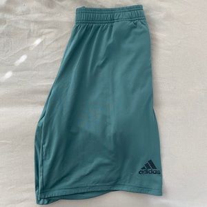Green adidas shorts